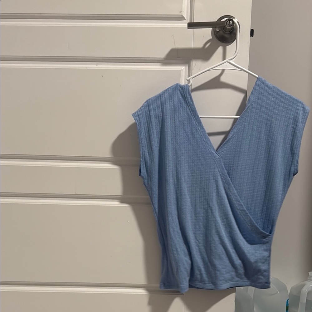 Chic Blue Sleeveless Wrap Blouse
